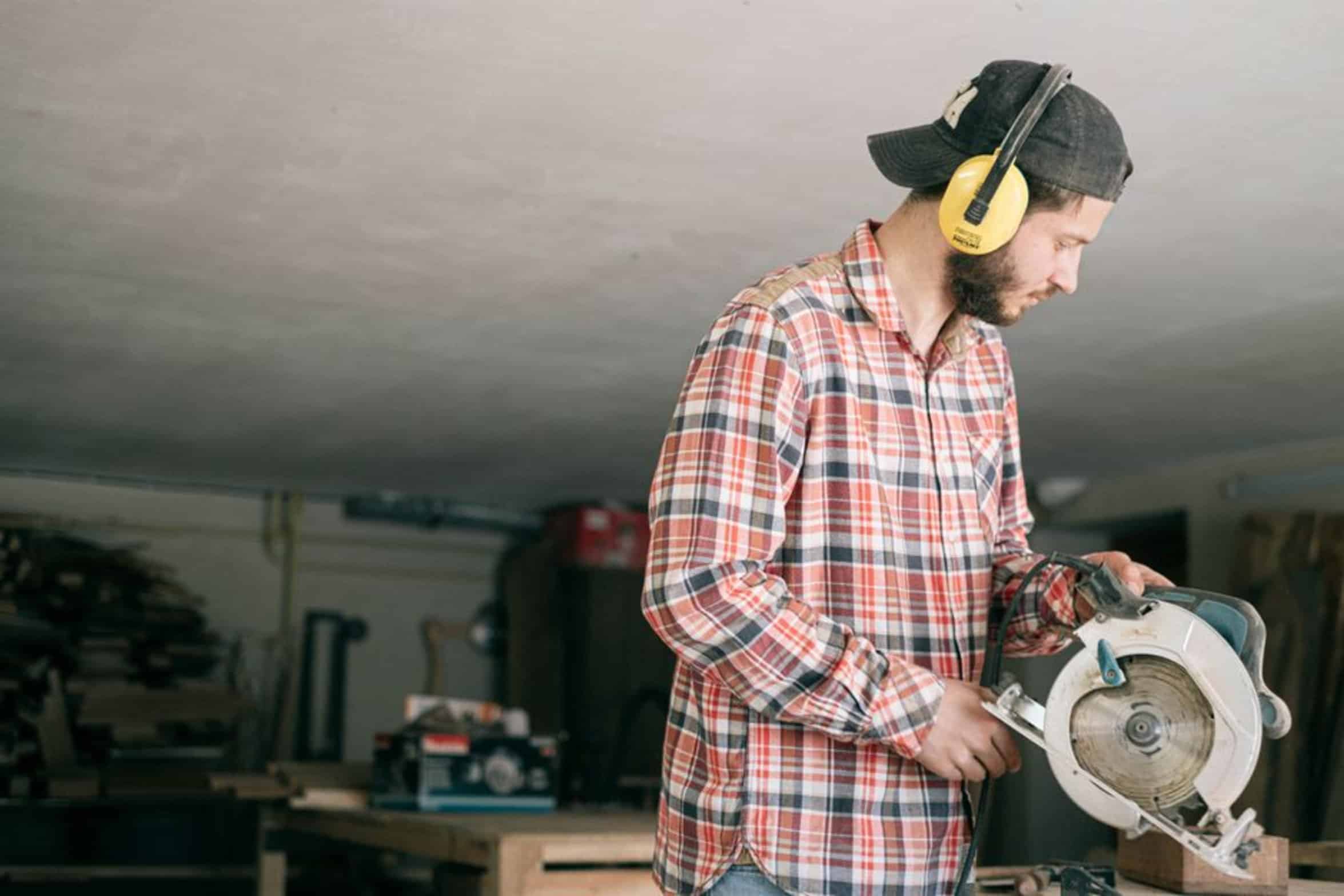 carpenter using saw carpenter using saw