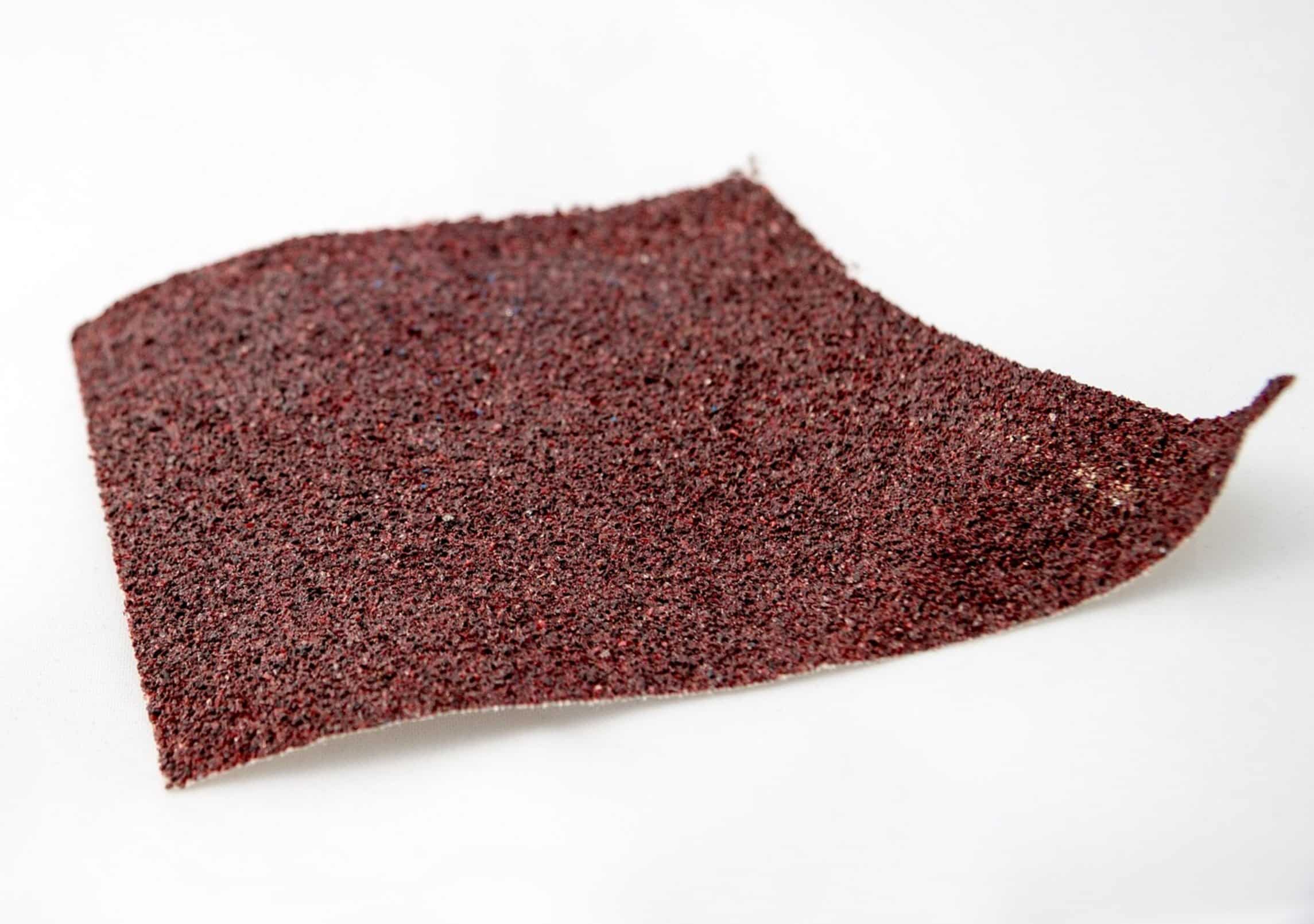 sandpaper on wood surface sandpaper on wood surface