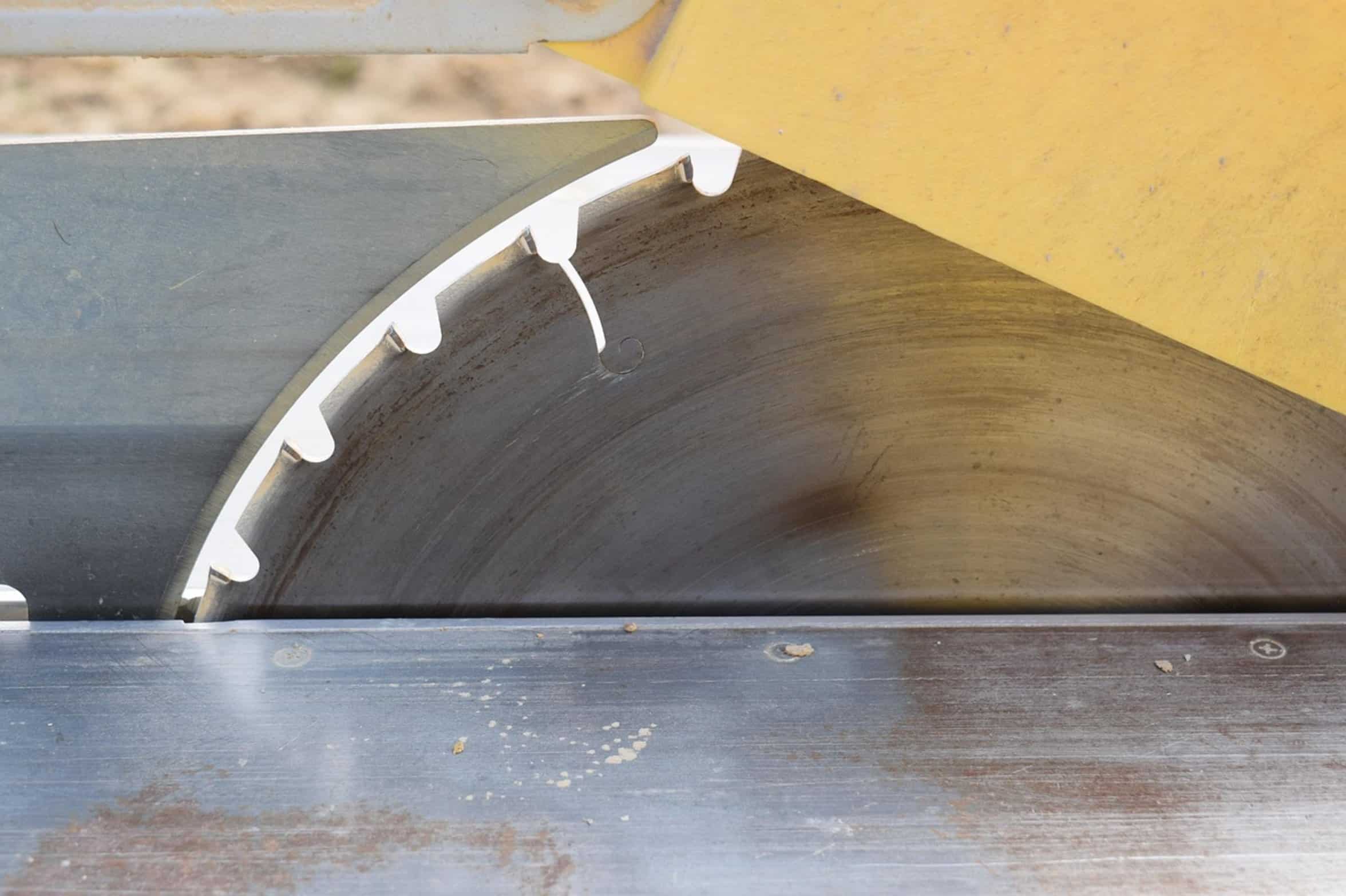 woodworker using table saw woodworker using table saw