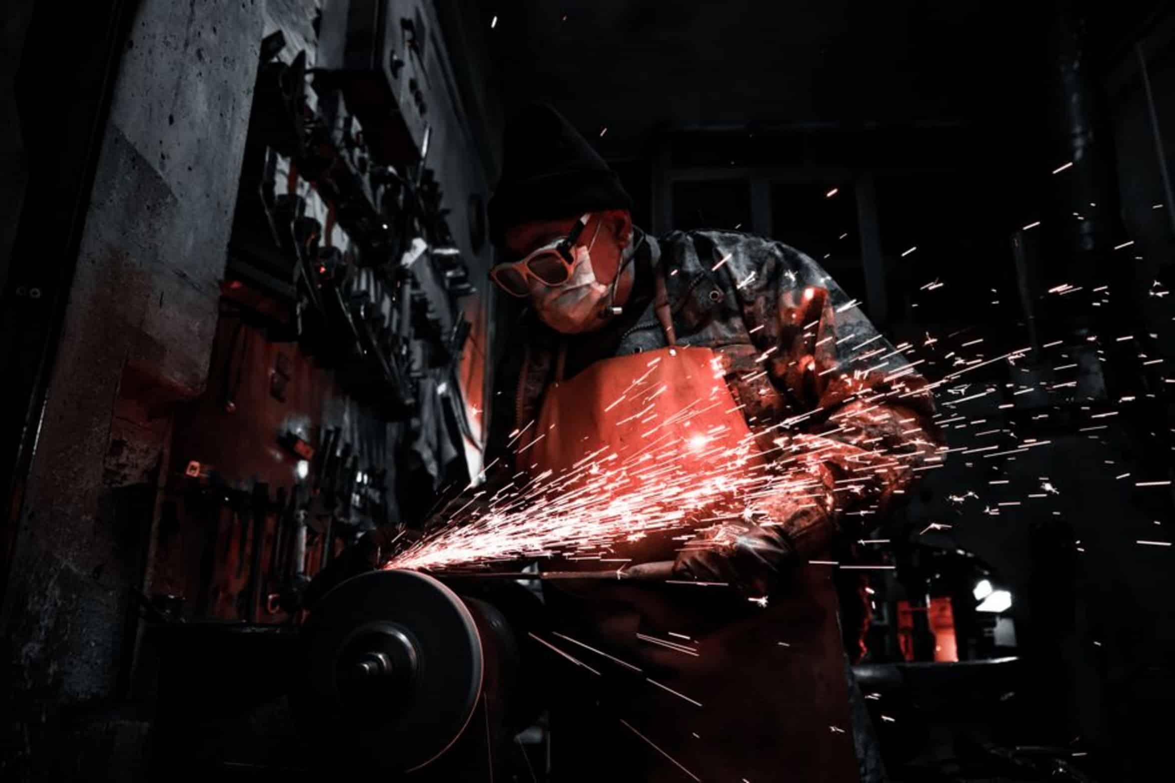 worker wearing face shield ear protection worker wearing face shield ear protection